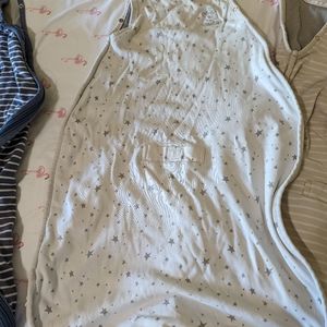 Two 2-24 month woolino sleep sacks in blue stripes and beige.